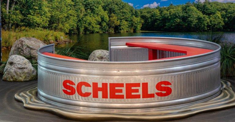 a tin bucket boat that says SCHEELS you can sit in for a photo!
